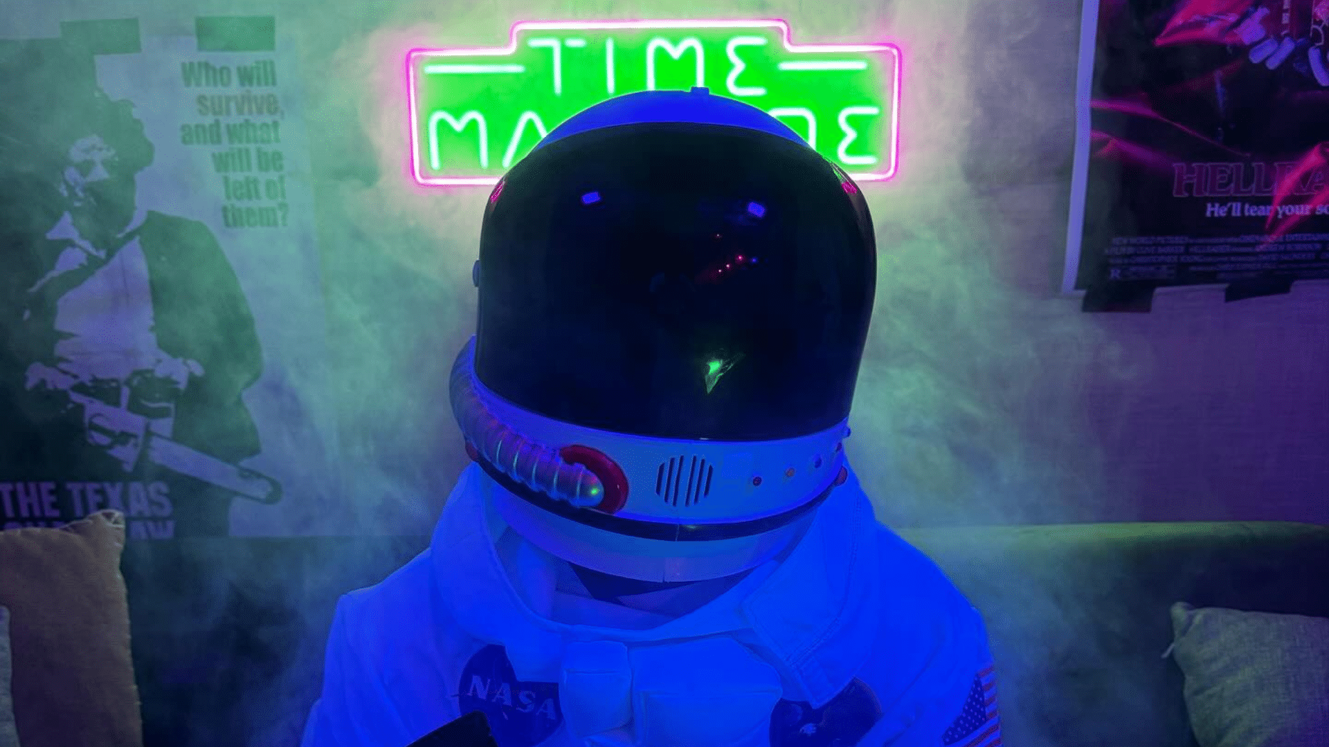 Astronaut in a neon-lit room representing Time Machine cannabis innovation and hydroponic growing.