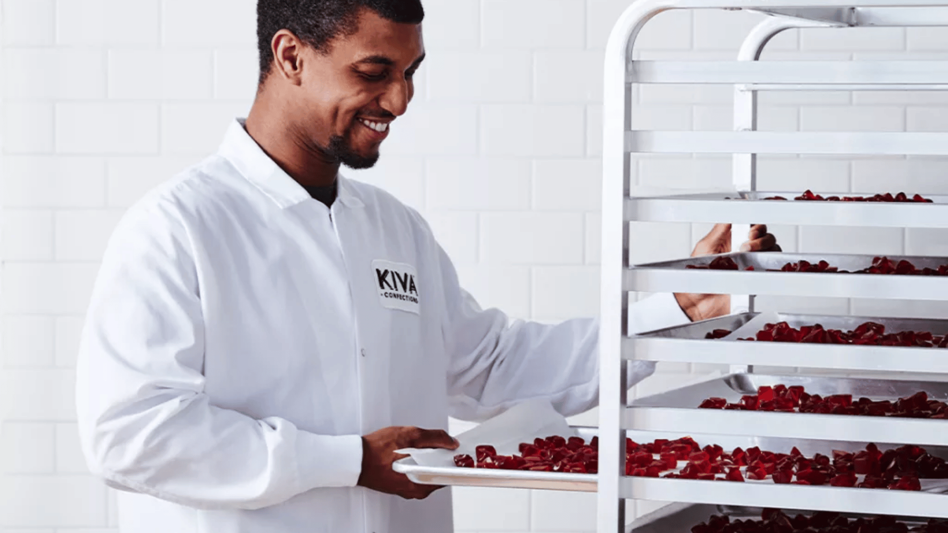 Kiva Confections employee preparing cannabis-infused gummies in the production facility.