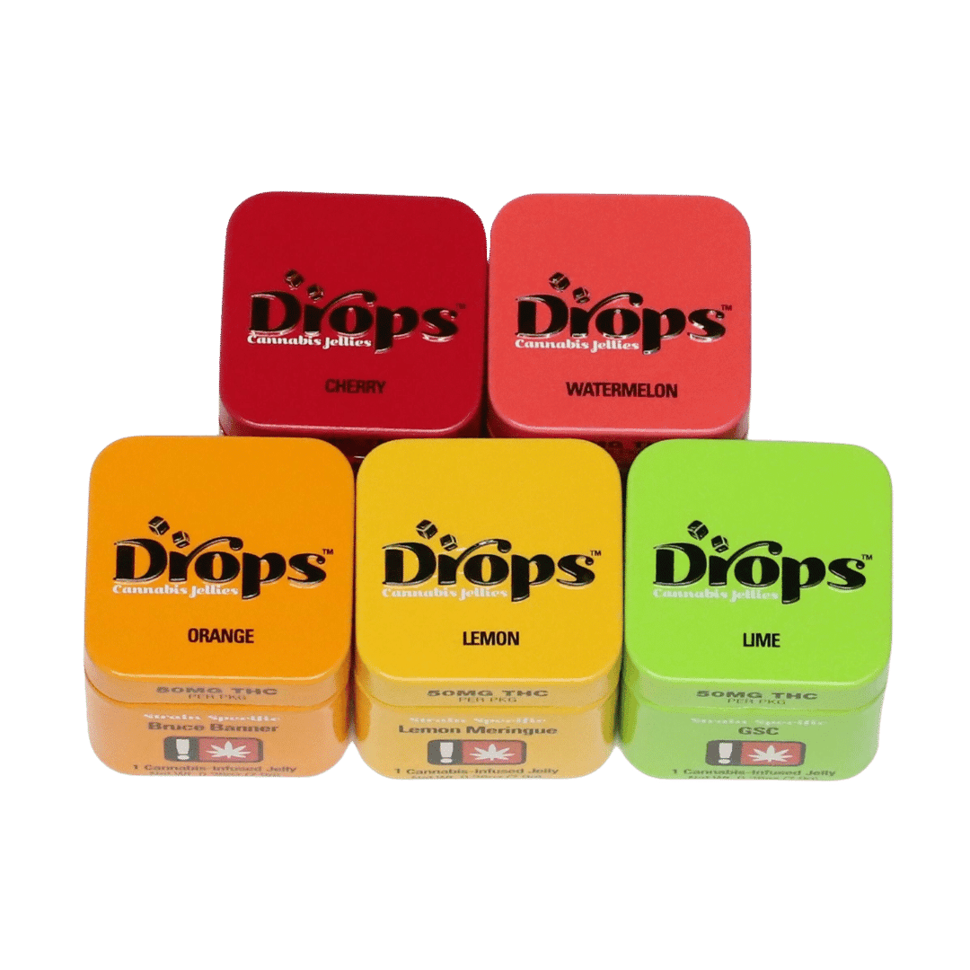 A colorful assortment of Drops cannabis edibles tins in cherry, watermelon, orange, lemon, and lime flavors, showcasing their premium packaging and vibrant appeal.