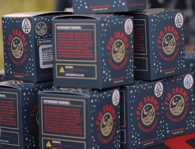 Stacked Fig Farms cannabis product boxes featuring branded packaging with vibrant designs.