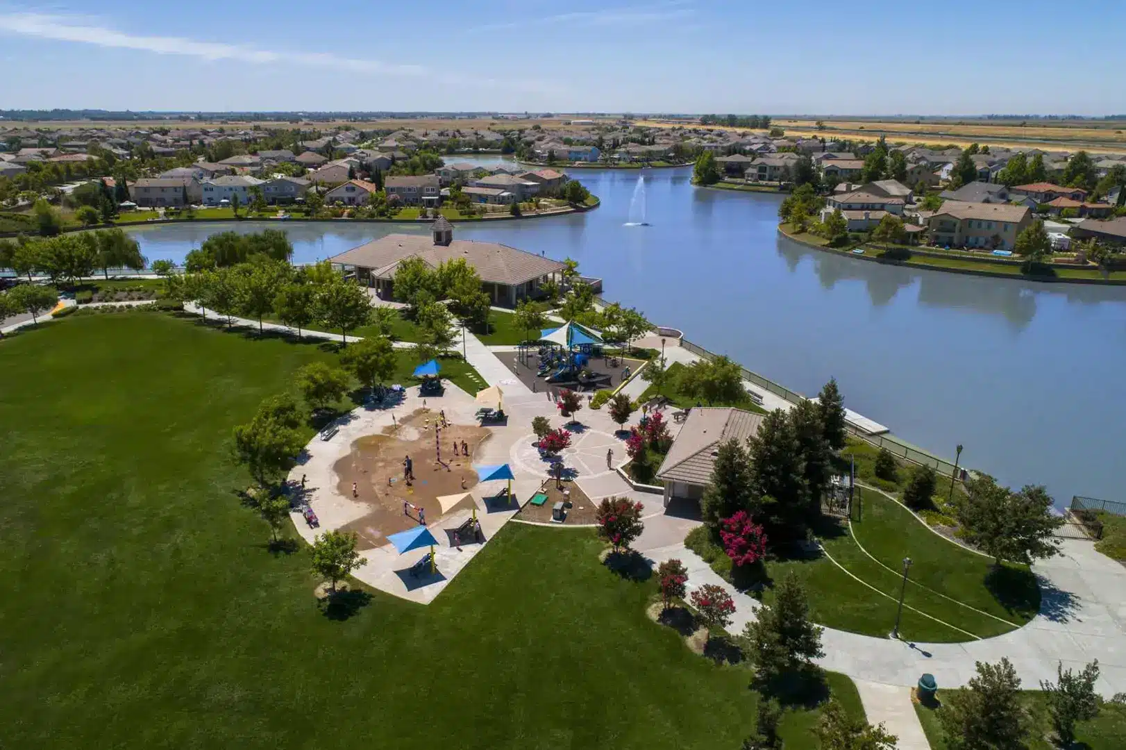 bridgeway-lakes-community-park Aerial view of Bridgeway Lakes Community Park in West Sacramento, CA featuring splash pad, green lawns, and scenic lake