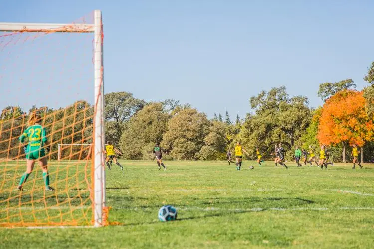 cherry-island-soccer-complex Youth soccer match at Cherry Island Soccer Complex in Elverta, CA — large field surrounded by trees and natural landscape.